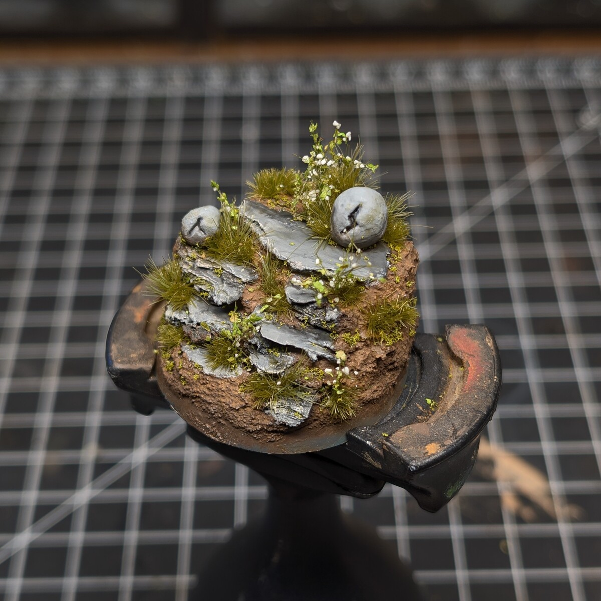 Overgrown stone slate base